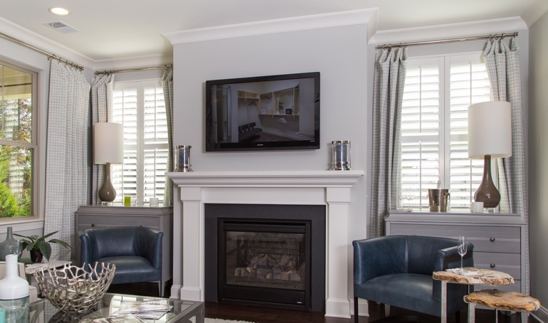 New York fireplace with white shutters.